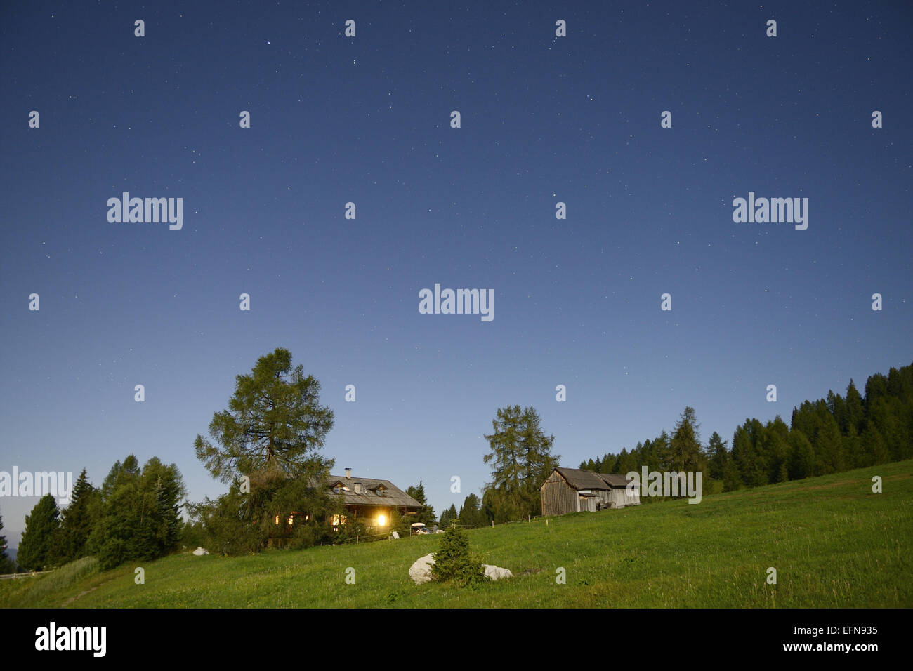 Starry sky over the hill in the dolomites, summer season Stock Photo