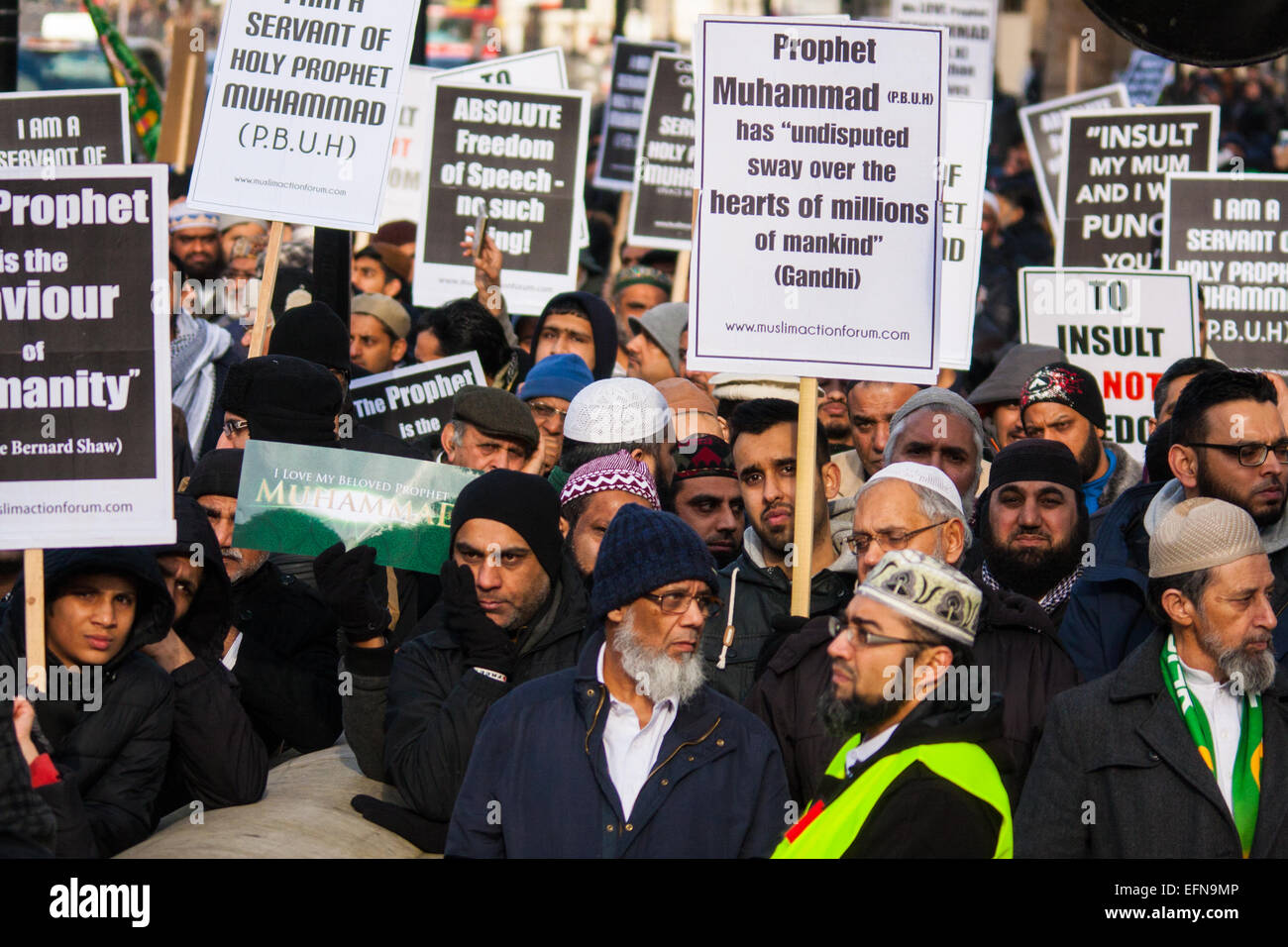 London, February 8th 2015. Muslims demonstrate outside Downing Street  'to denounce the uncivilised expressionists reprinting of the cartoon image of the Holy Prophet Muhammad'. Credit:  Paul Davey/Alamy Live News Stock Photo