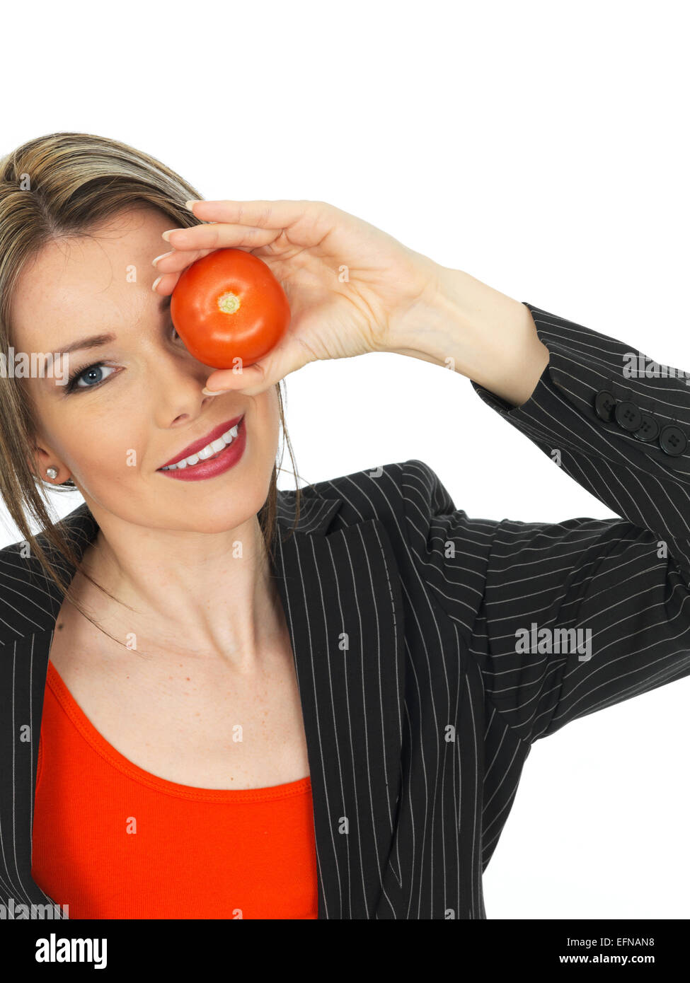Young Healthy Business Woman Holding a Raw Tomato Stock Photo - Alamy