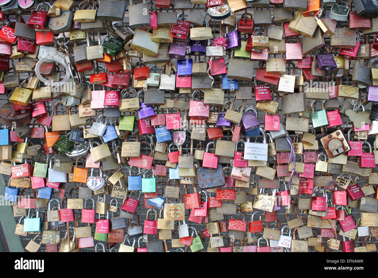 Cologne, Germany-6th Aug 2013. One of the main tourist attractions is the colorful love padlocks across the Hohenzollern Bridge. Stock Photo