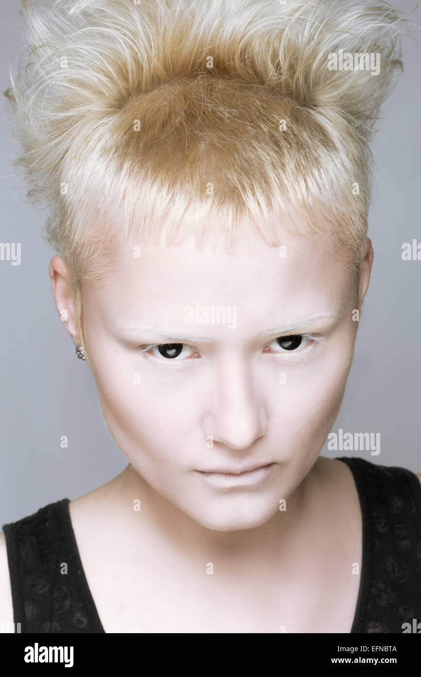 angry aggressive girl in black lenses. Stock Photo
