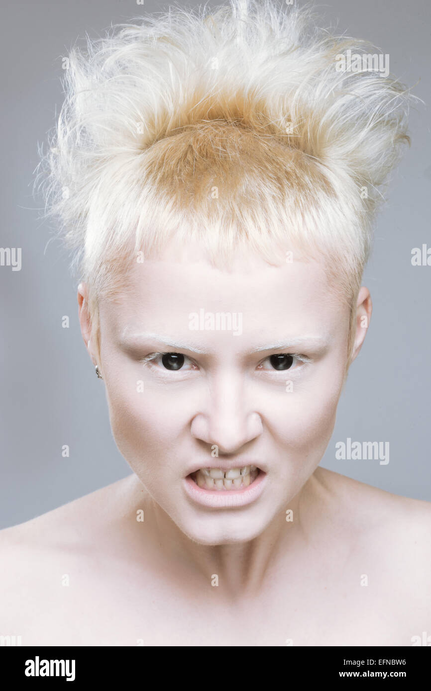 angry aggressive girl in black lenses. Stock Photo