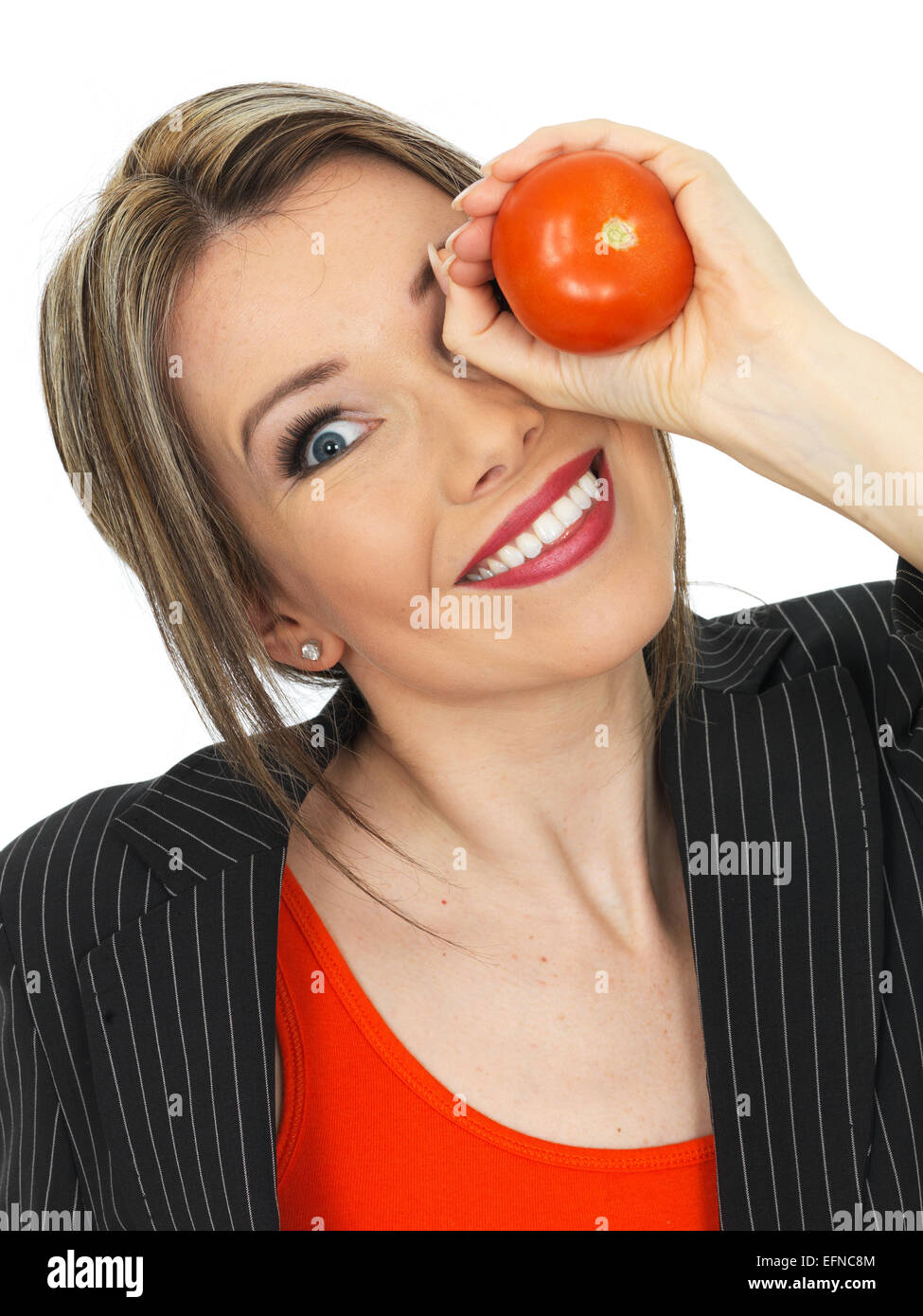 Young Healthy Business Woman Holding a Raw Tomato Stock Photo - Alamy