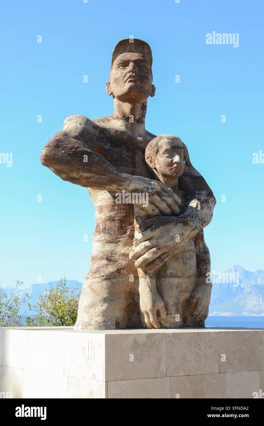 Statue of man protecting child, Antalya, Turkey Stock Photo