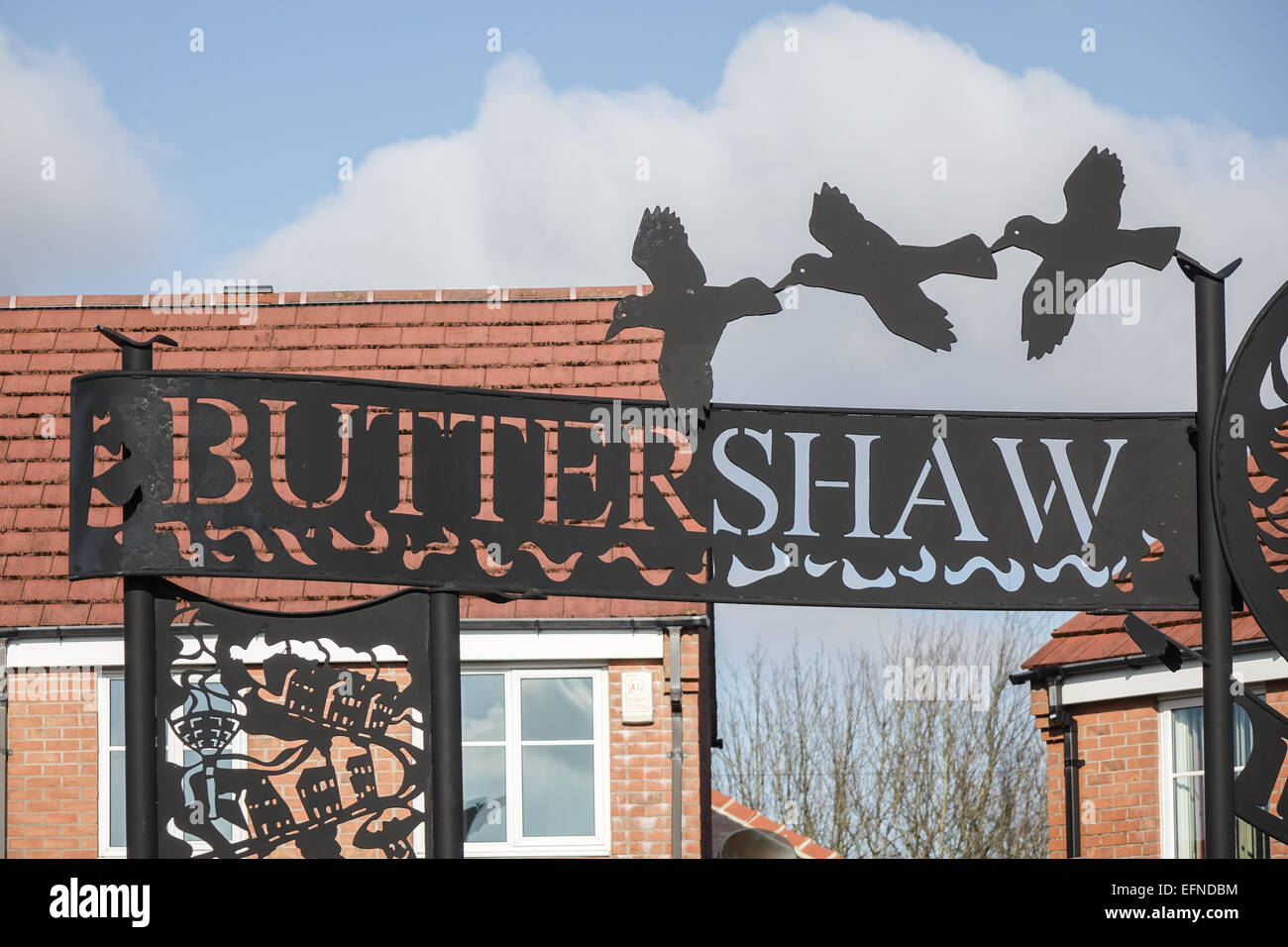 Buttershaw Estate, Bradford, West Yorkshire. Wrought Iron sign at one of the entrances to the large local authority 1950's council housing estate. Stock Photo