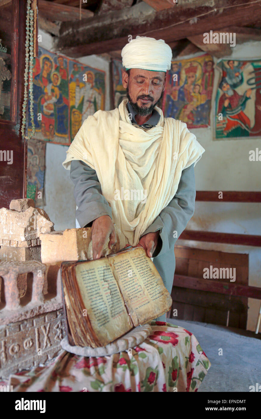 Priest of Yeha church showing old manuscript, Yeha, Tigray region, Ethiopia Stock Photo