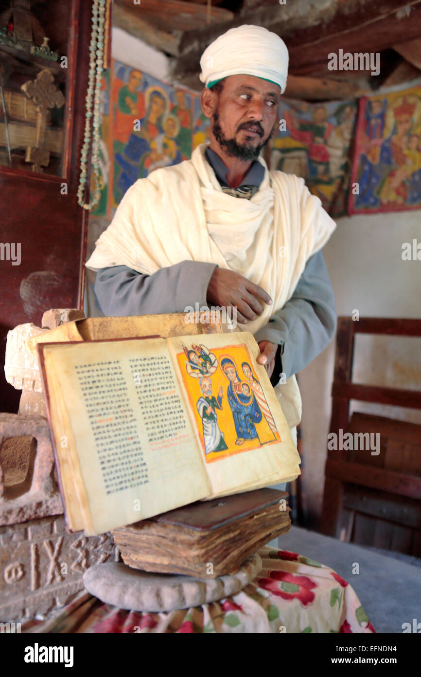 Priest of Yeha church showing old manuscript, Yeha, Tigray region, Ethiopia Stock Photo