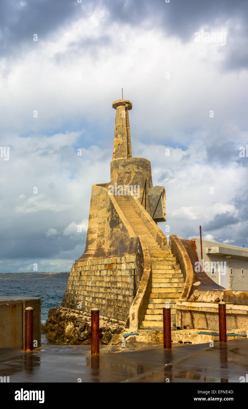 Old lighthouse at Marfa Point, next to the ferry terminal - Cirkewwa, Malta. Stock Photo