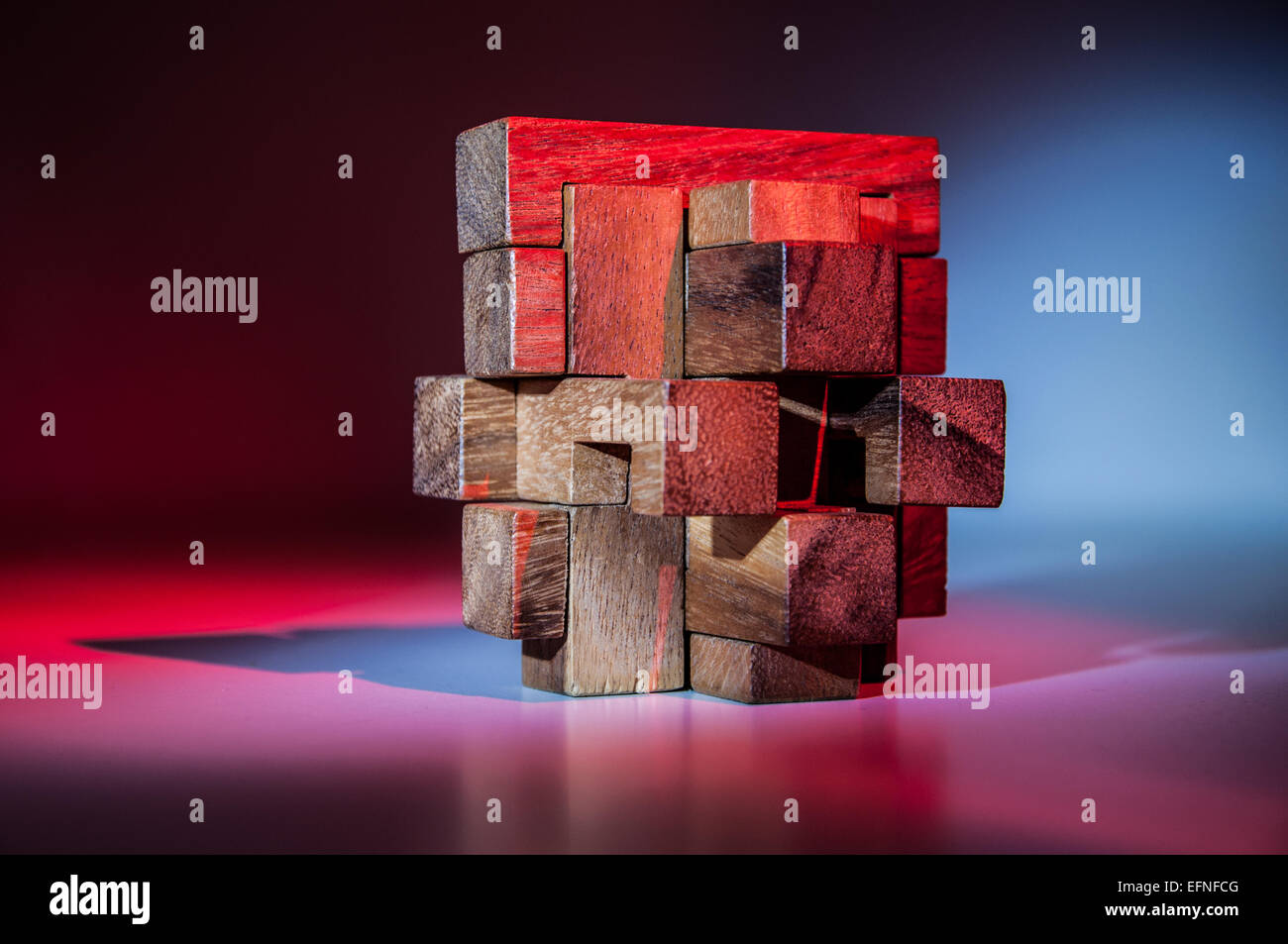 3D wood puzzle over a red and blue background Stock Photo