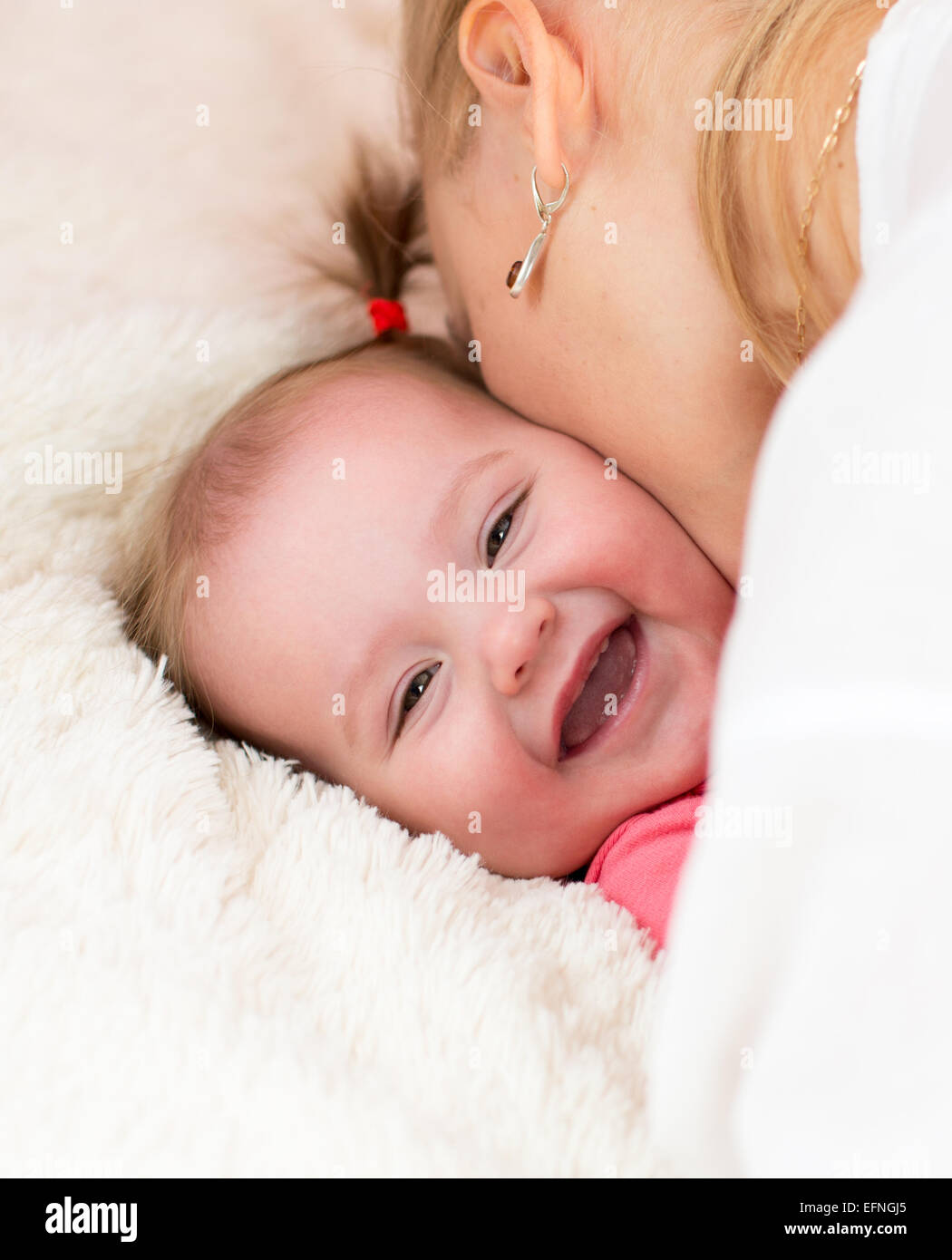 Happy mother kissing baby Stock Photo Alamy