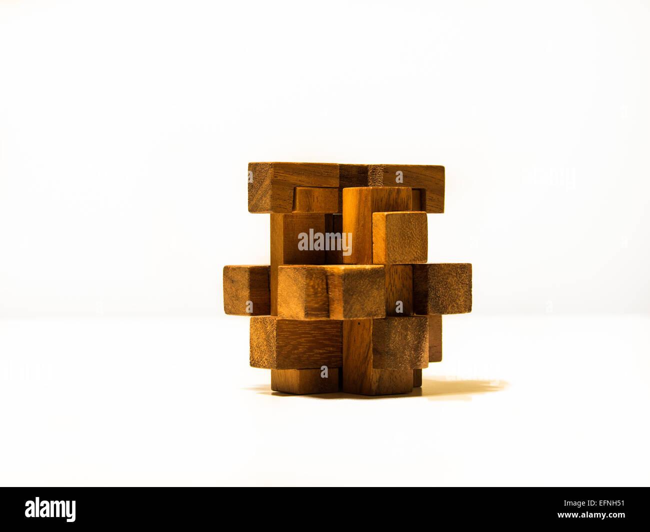 Image of a 3D wooden puzzle over a white background Stock Photo