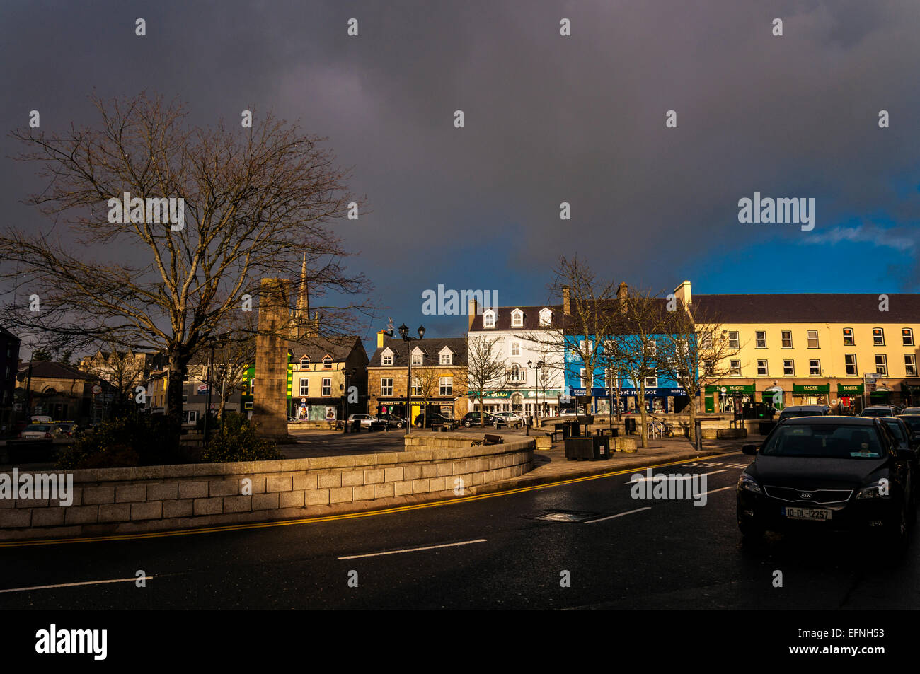 Donegal Town The Diamond as sunlight breaks through storm clouds. County Donegal Ireland .Street scene daily life. Stock Photo