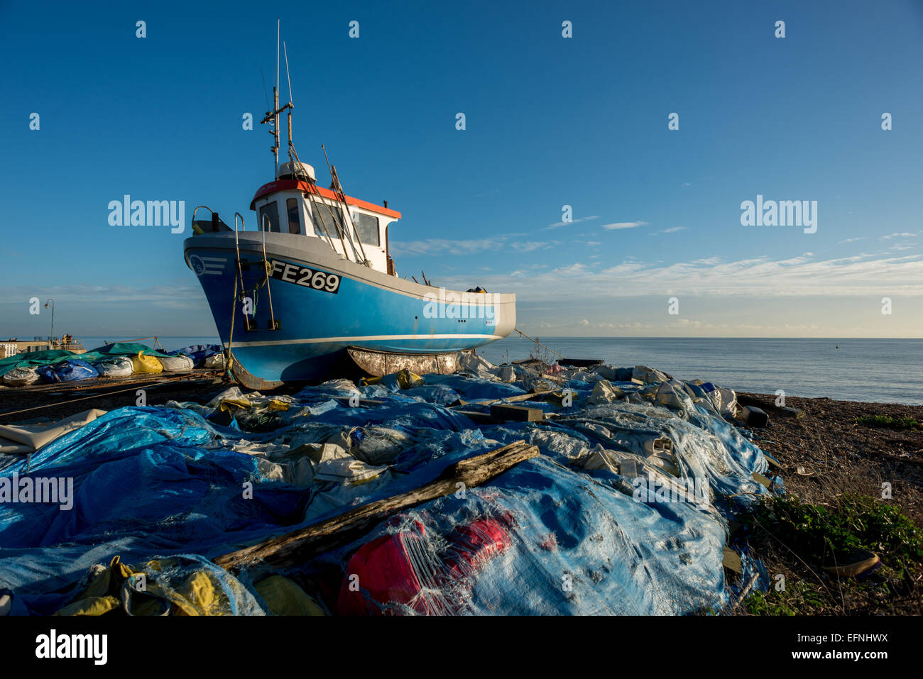 Fishing boat on the beach at Hythe, Kent. Stock Photo