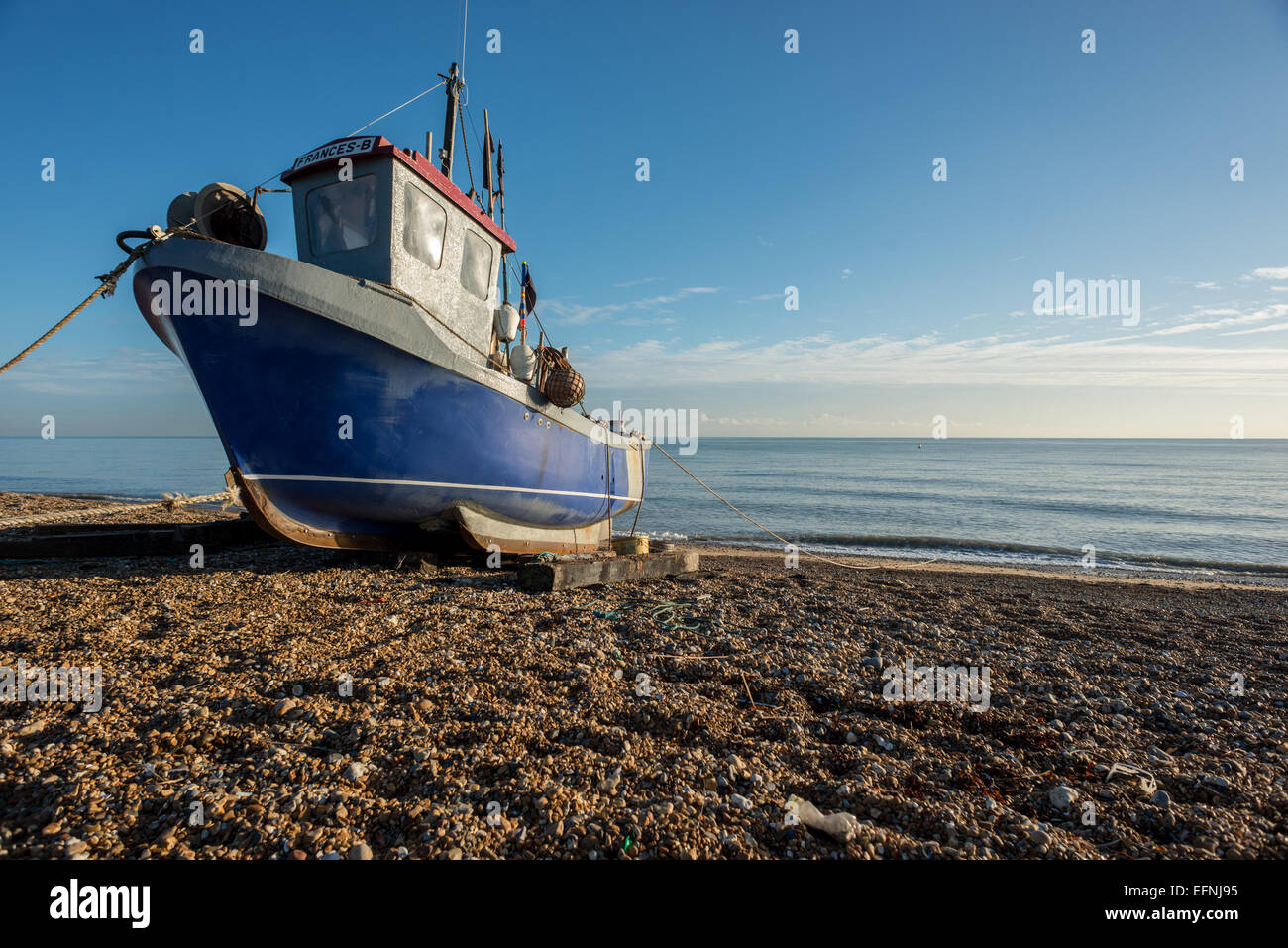 Fishing boat on the beach at Hythe, Kent. Stock Photo