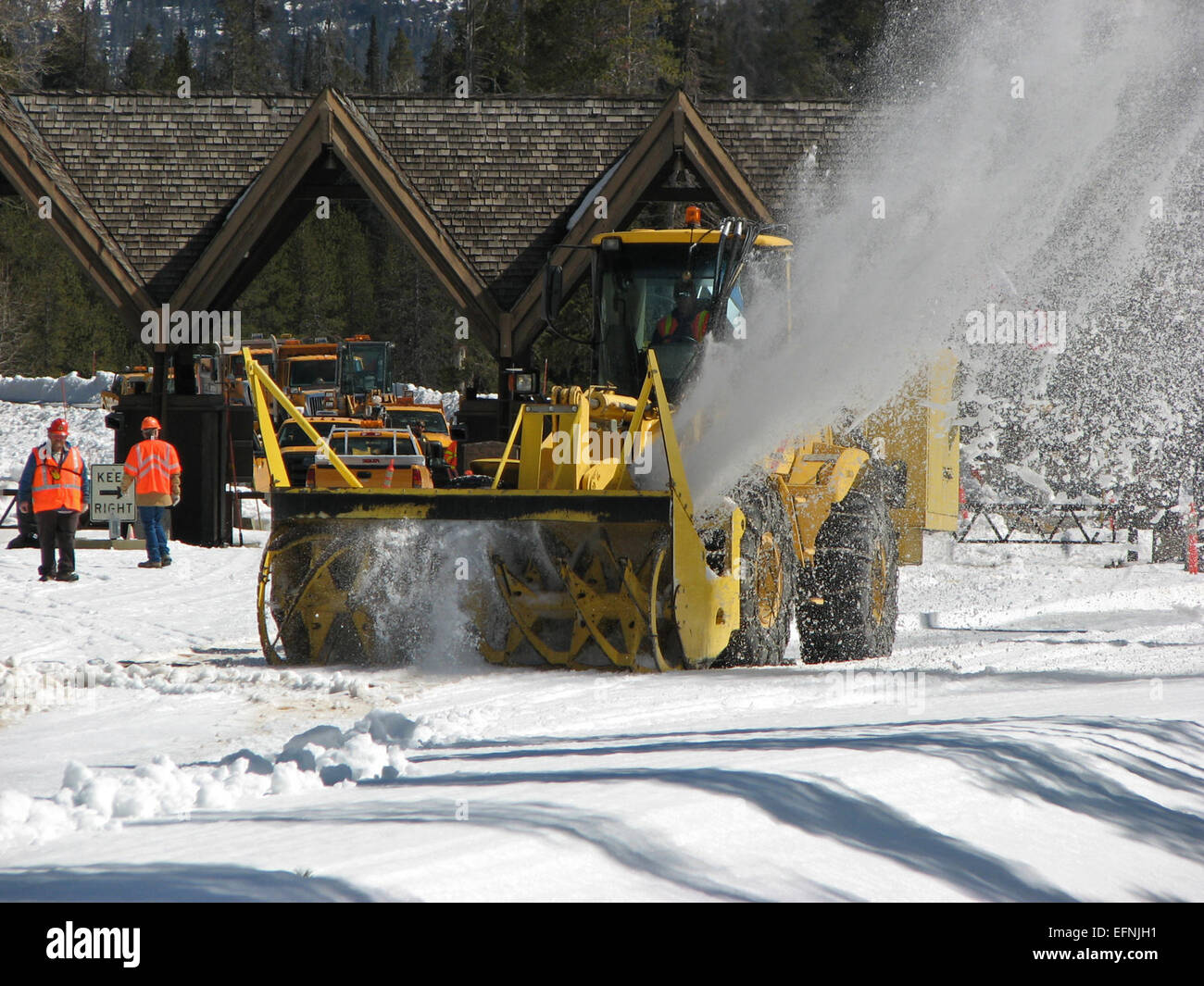 Wyoming Department of Transportation rotary clearing snow inside Yellowstone's East Entrance Stock Photo