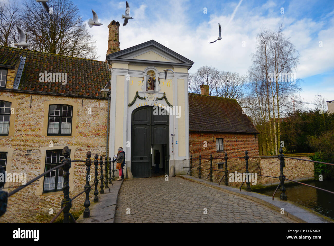 Begijnhof Bridge And Door In Brugge, Belgium Stock Photo