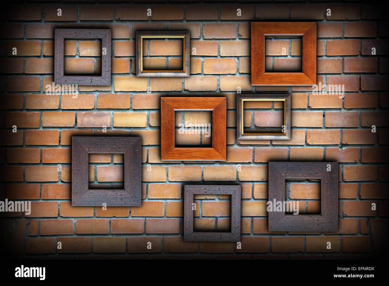 brick wall with picture wooden frames for your message Stock Photo