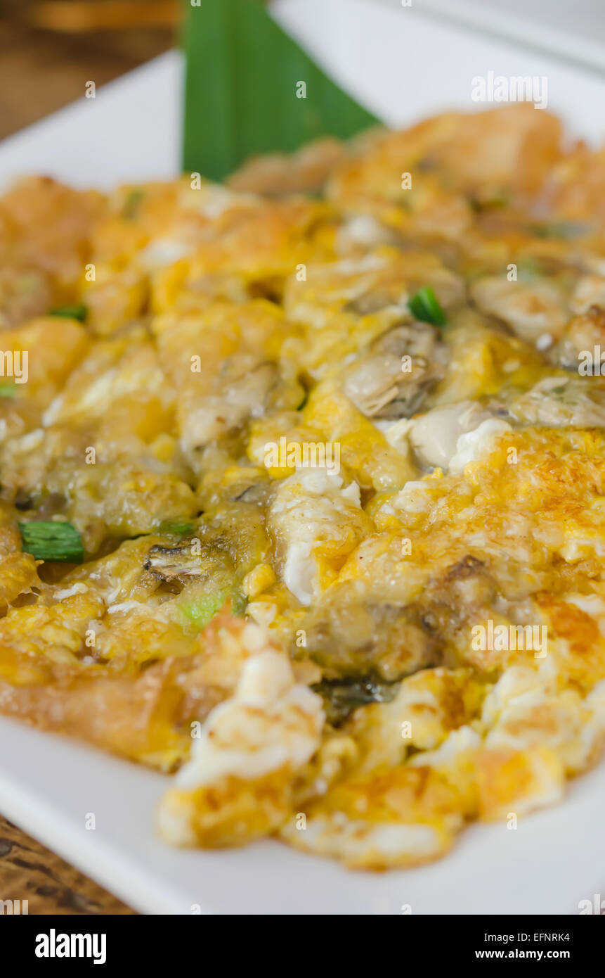 Southeast Asian Fried Baby Oyster Omelette  on dish Stock Photo