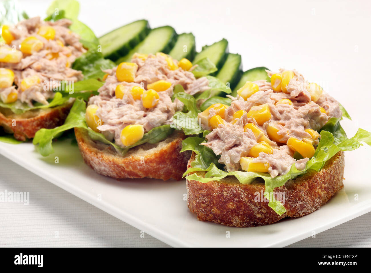 Sandwich with tuna and corn on white background Stock Photo Alamy