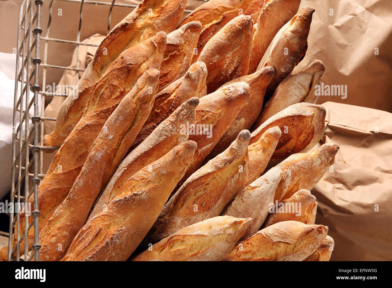 French baguettes in metal basket in bakery Stock Photo Alamy