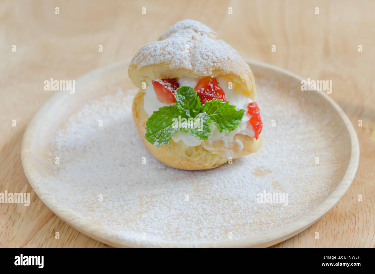 fresh strawberry Choux Cream on wooden dish Stock Photo