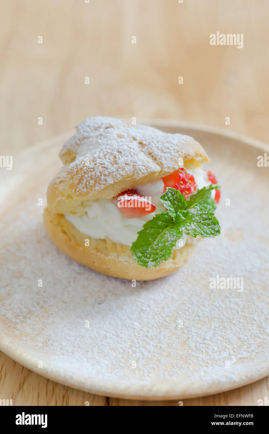 fresh strawberry Choux Cream on wooden dish Stock Photo