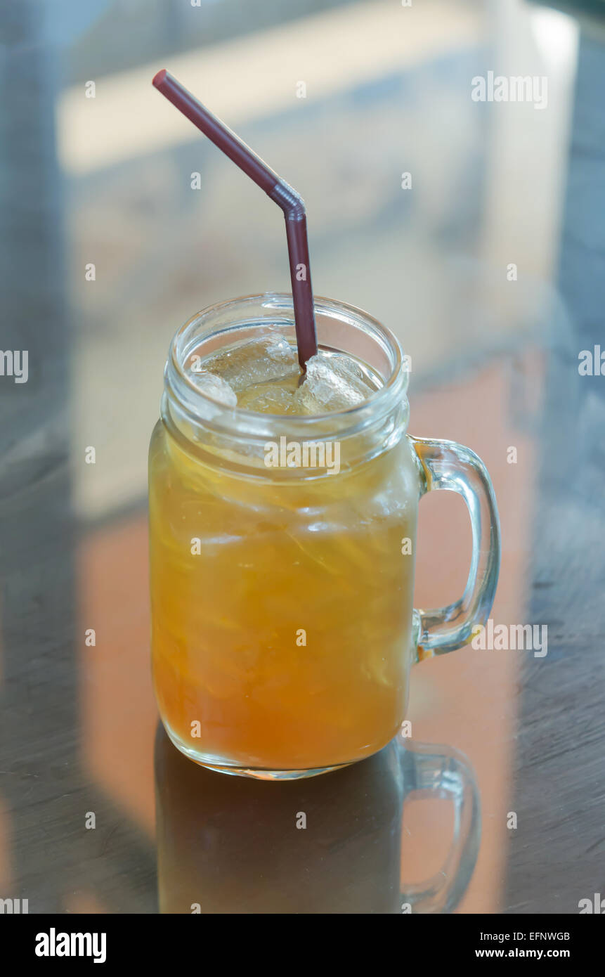 ice tea with drinking straw on the table Stock Photo