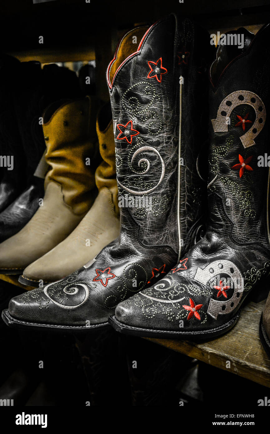 Decorative and unique cowboy boots on display for sale at downtown