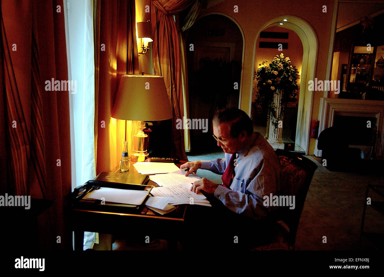 US Secretary of Defense Donald Rumsfeld reviews his speech before the start of the 41st Conference on Security Policy February 12, 2005 in Munich, Germany. Stock Photo