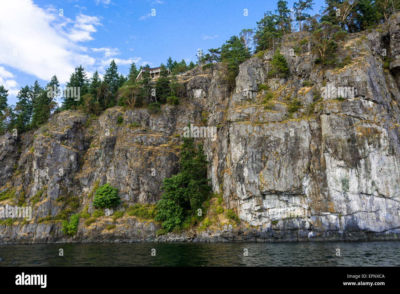 North America, Canada, British Columbia, Quadra Island, house at top of cliff Stock Photo