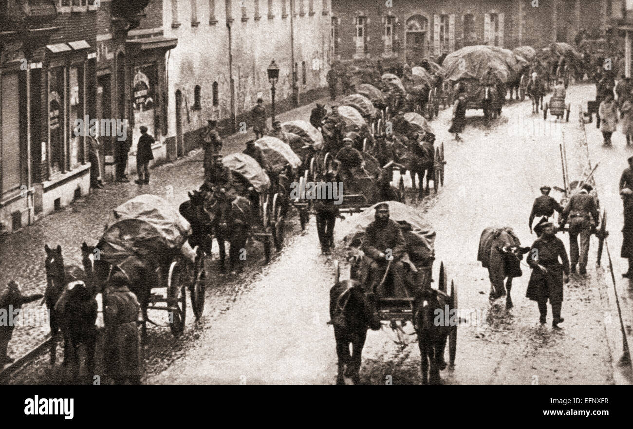 A line of wagons and broken German troops march through Belgium in their retreat at the end of World War One. Stock Photo