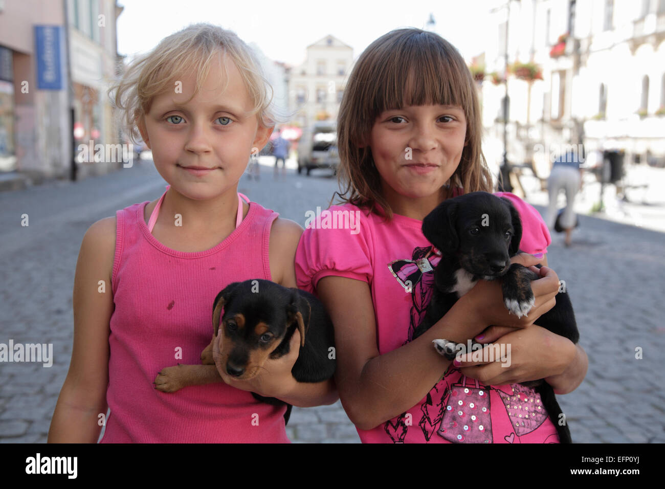 Young girls with dogs, Ladek Zdroj (Bad Landeck), Silesia, Poland, Europe Stock Photo