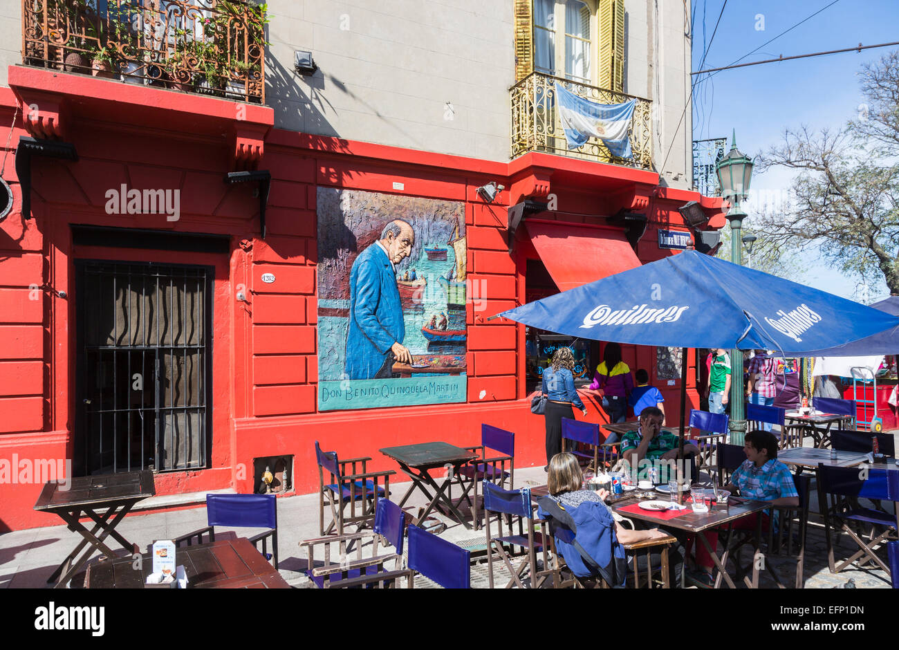 Colourful mural sign outside a roadside restaurant depicting artist Don Benito Quinquela Martin painting, La Boca, Buenos Aires, Argentina Stock Photo