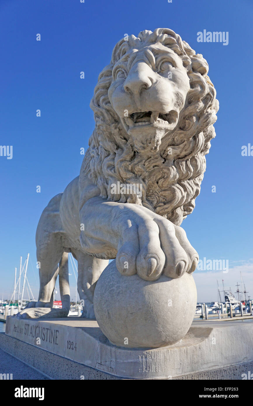 Stone lion guarding entrance to Bridge of Lions on Matanzas Bay in St. Augustine, Florida. Stock Photo
