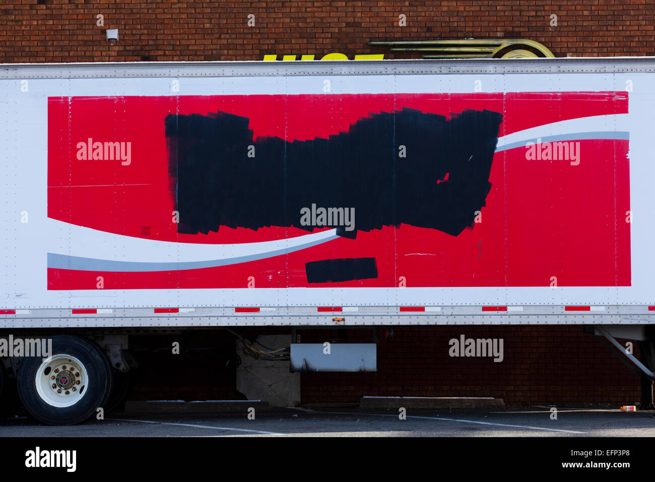 Vintage Coca-Cola logo painted over on side of trailer - USA Stock Photo