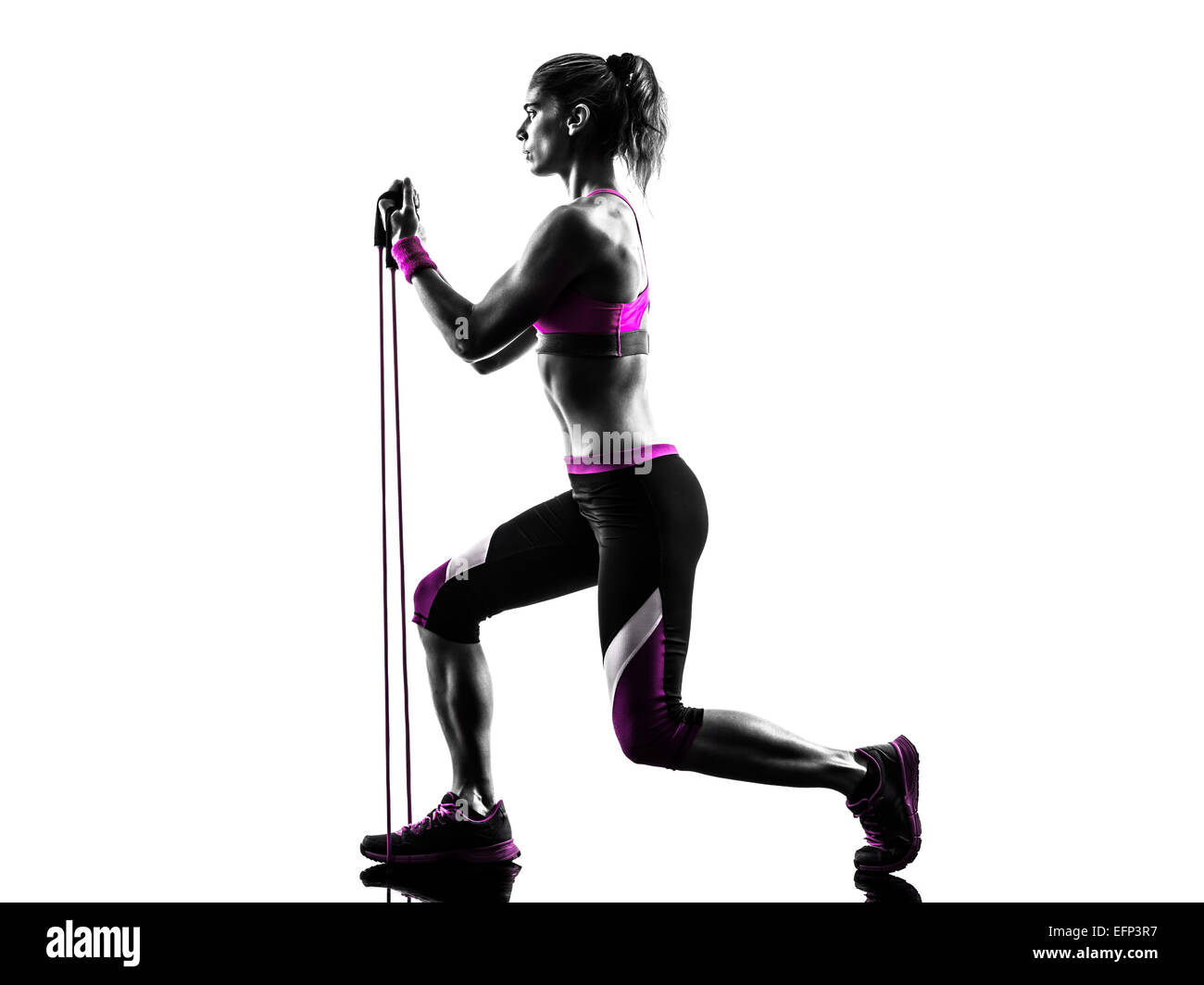 one caucasian woman exercising  fitness resistance bands in studio silhouette isolated on white background Stock Photo