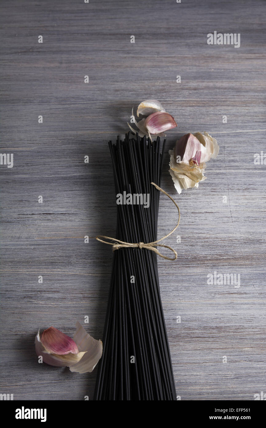 Raw black spaghetti with squid ink Stock Photo