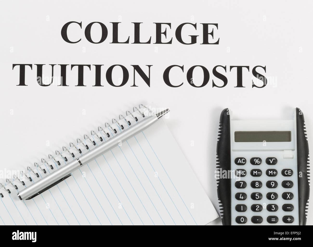 Overhead view of white paper with wording of college tuition costs