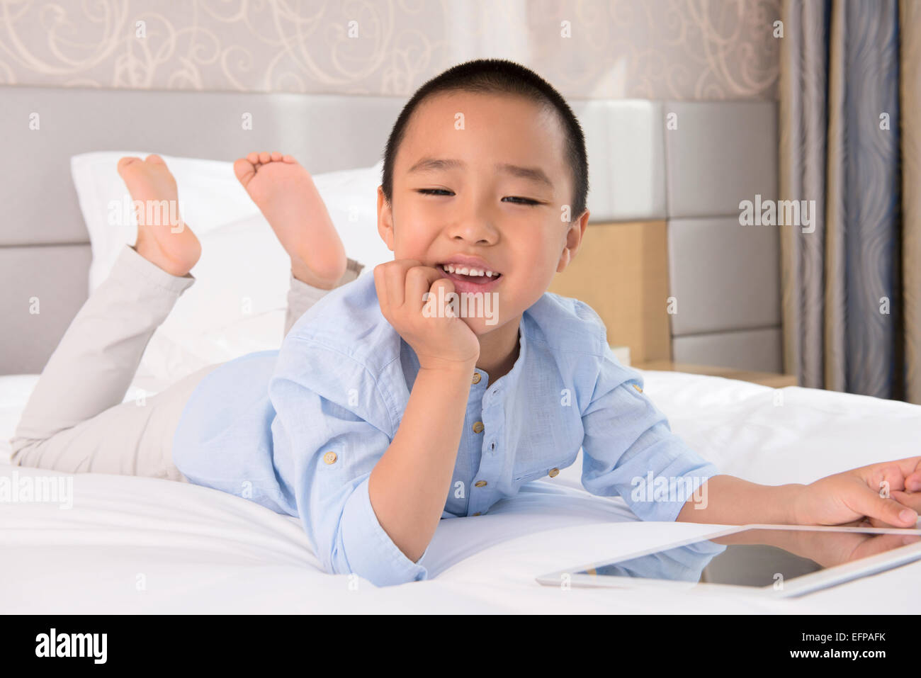 Boy lying in bed bed hires stock photography and images Alamy