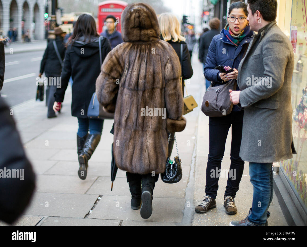 rich woman wearing real fur coat street mink sable Stock Photo