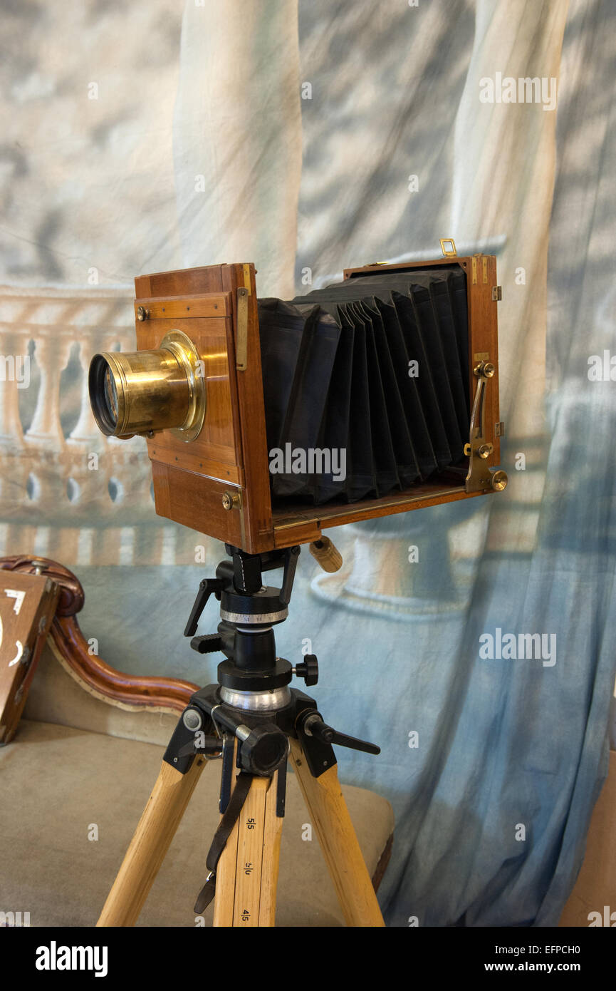 Old fashioned 10x8 glass plate camera complete with Petzval lens, mounted on a tripod. Stock Photo