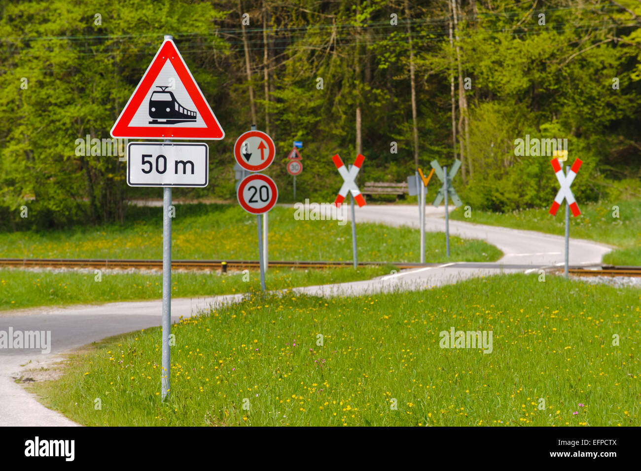 street and railway crossing in Bavaria Stock Photo