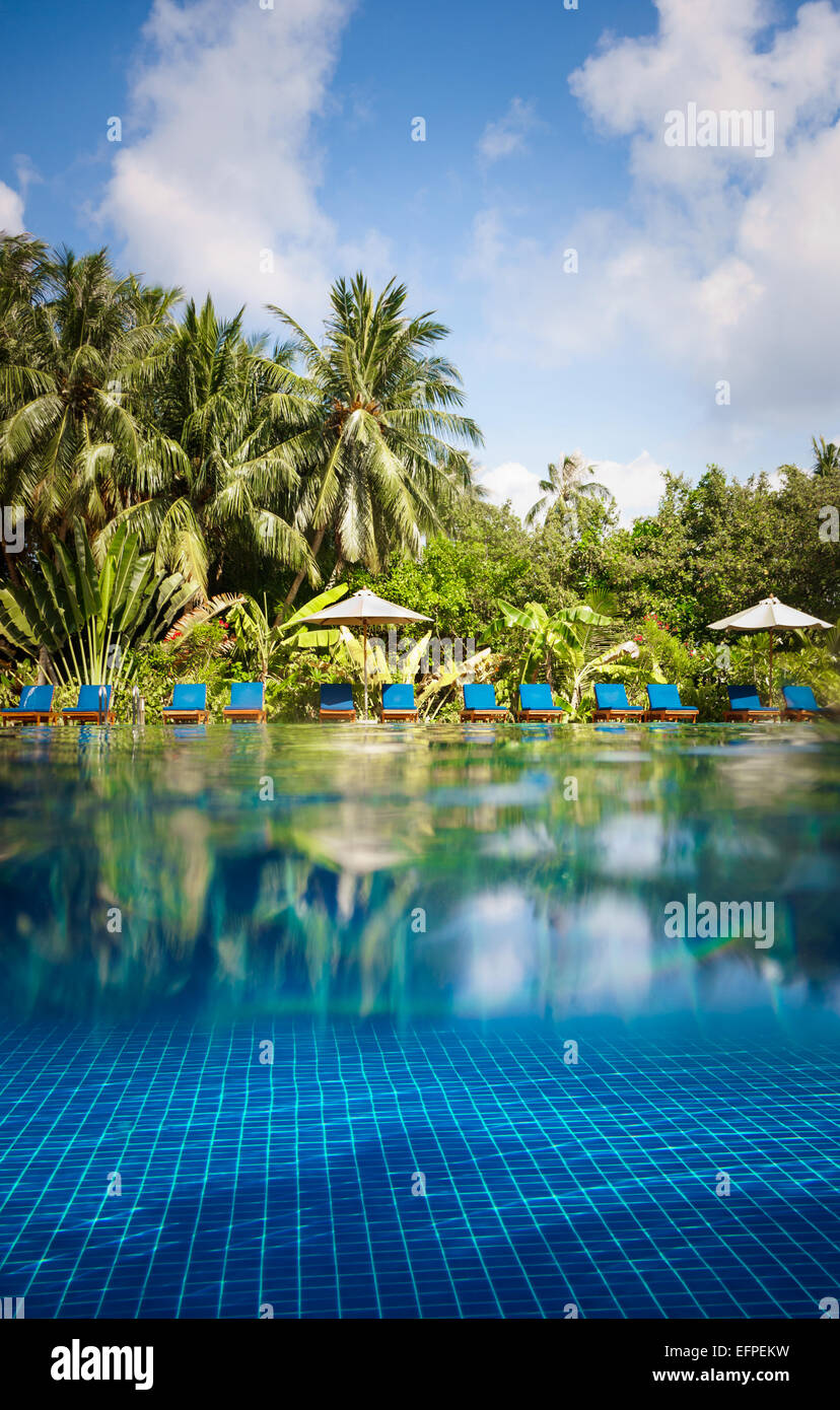 Tropical swimming pool views over the water and under water. Maldives. Stock Photo