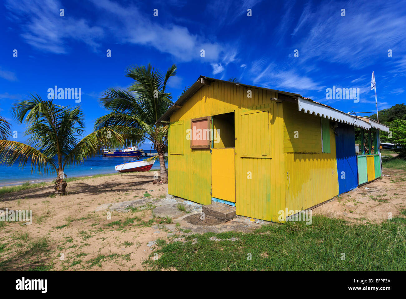 Colourful beach hut bar and boats, Saline Bay, Mayreau, Grenadines of St. Vincent, Windward Islands, West Indies, Caribbean Stock Photo