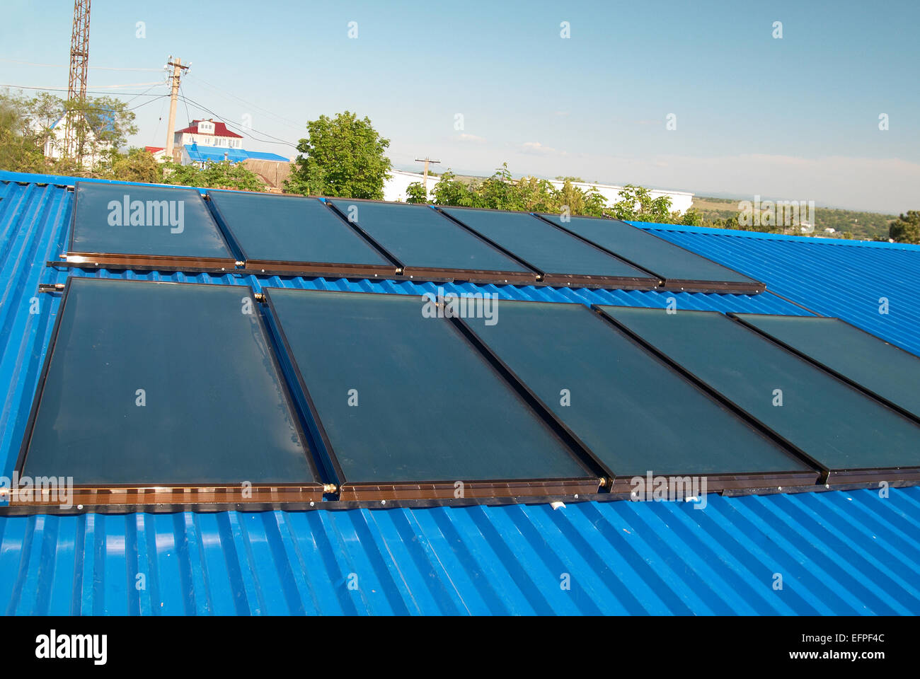 Solar water heating system on the house roof Stock Photo - Alamy