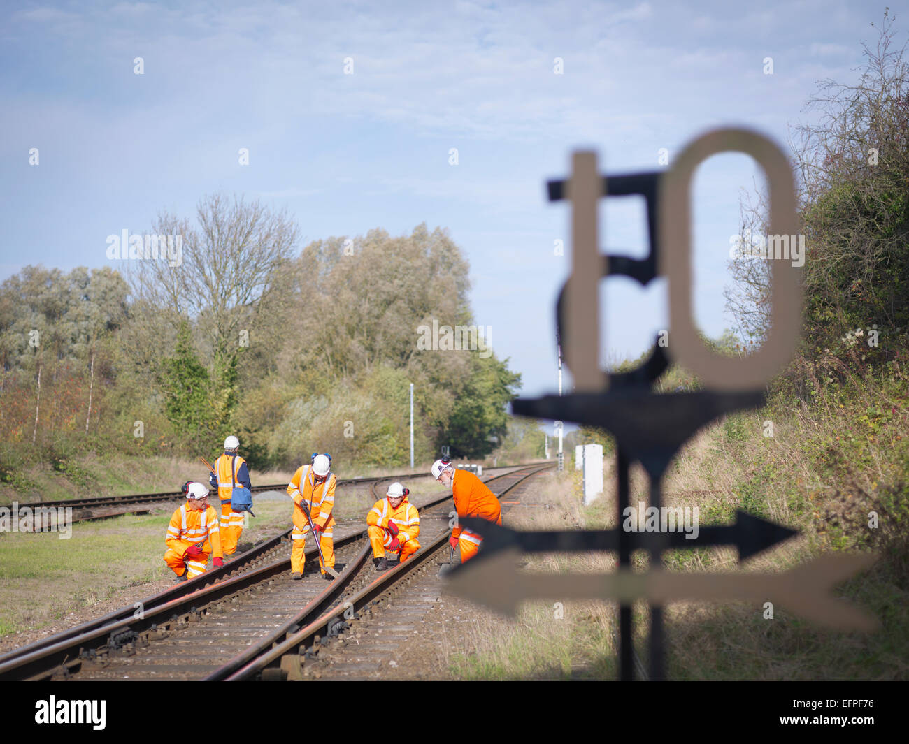 Railway workers on railway track Stock Photo