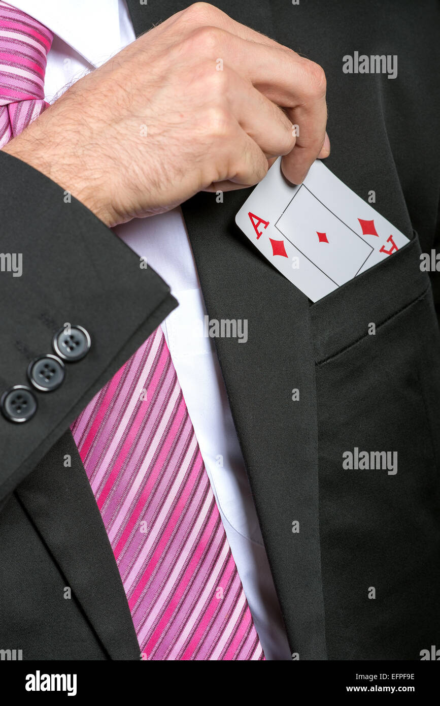 businessman pulling out his pocket aces cards Stock Photo Alamy