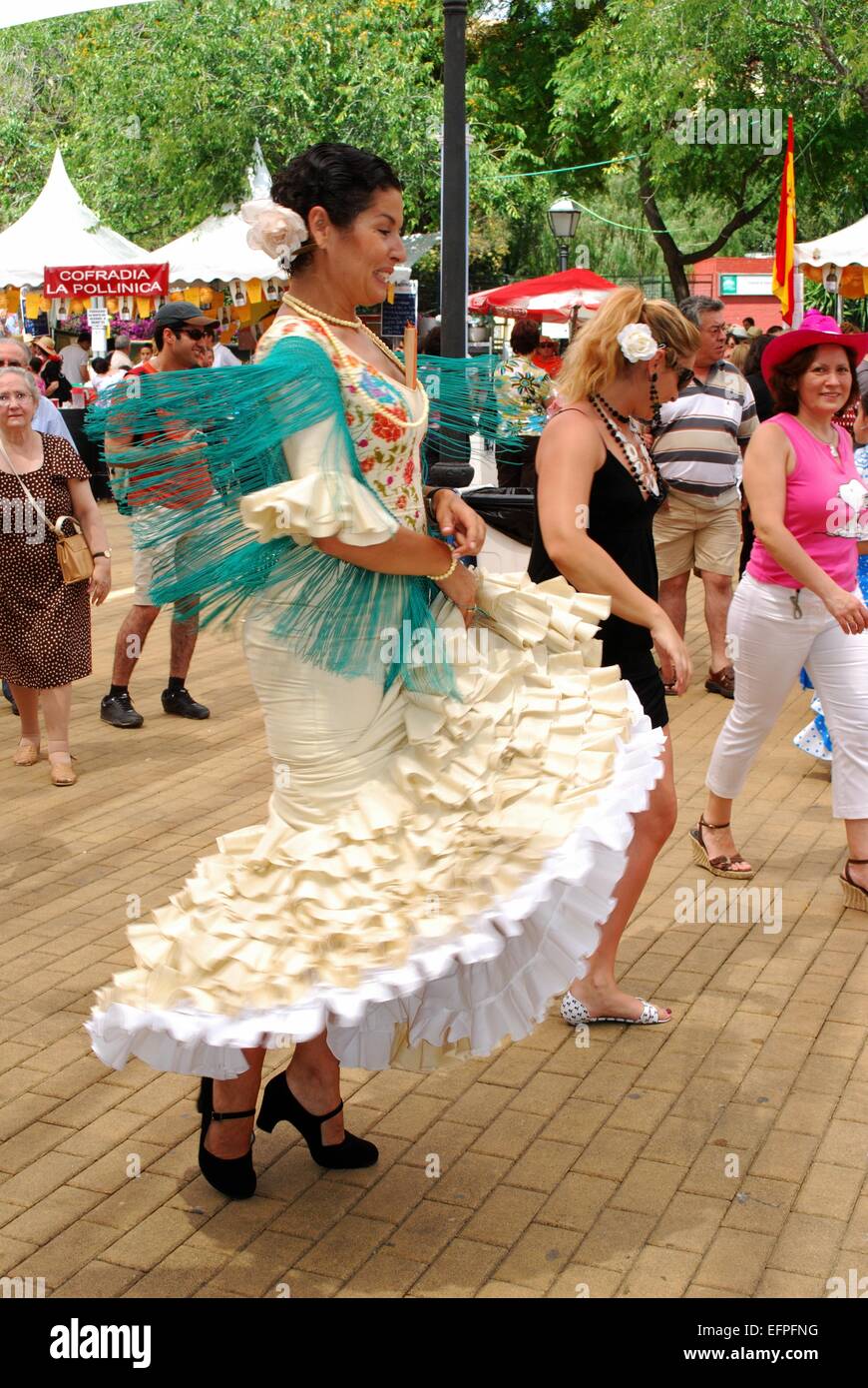 Spanish woman flamenco dancing during the Romeria San Bernabe festival, Marbella, Costa del Sol