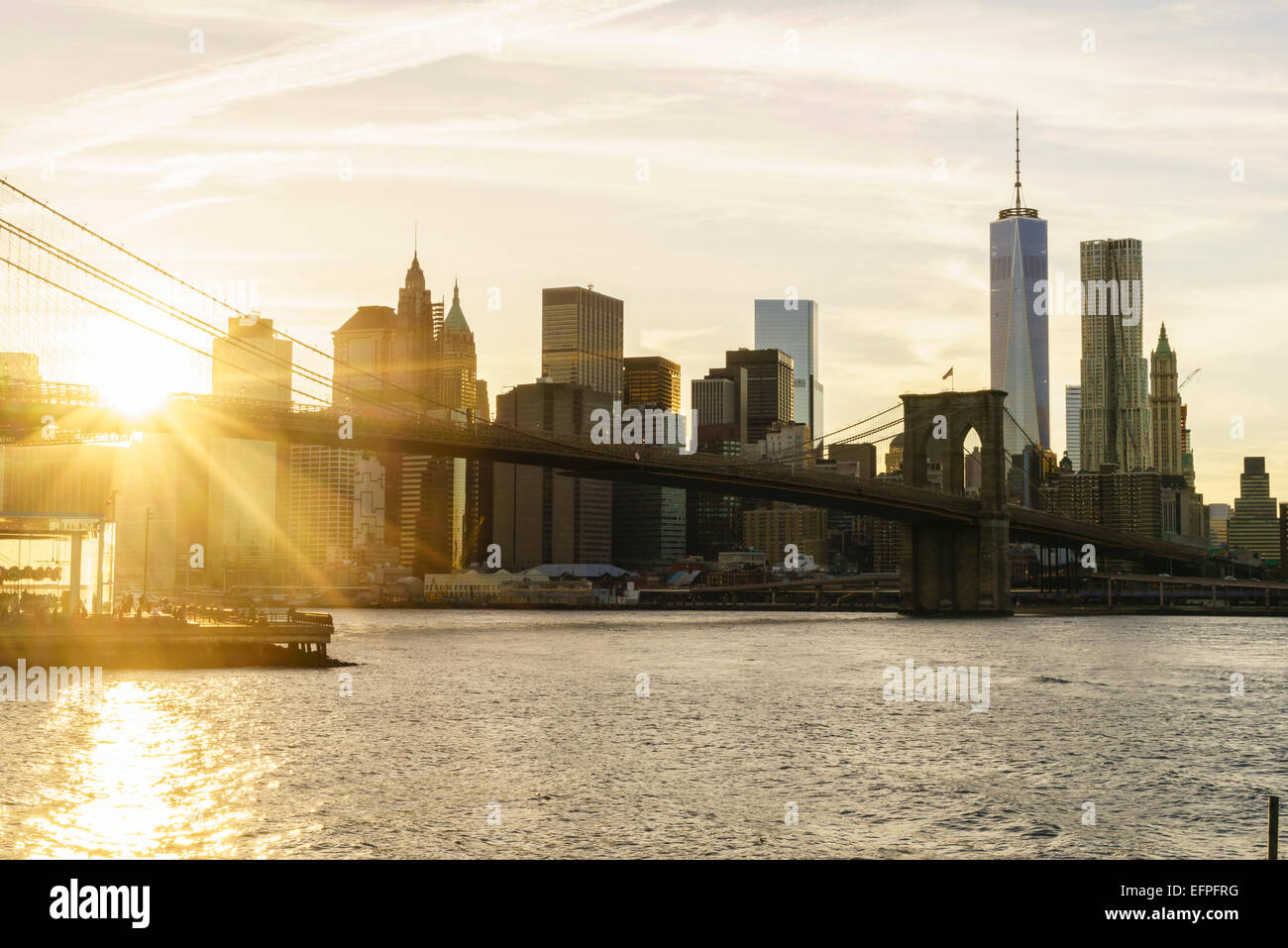 Brooklyn Bridge and Lower Manhattan skyline at sunset, New York City ...