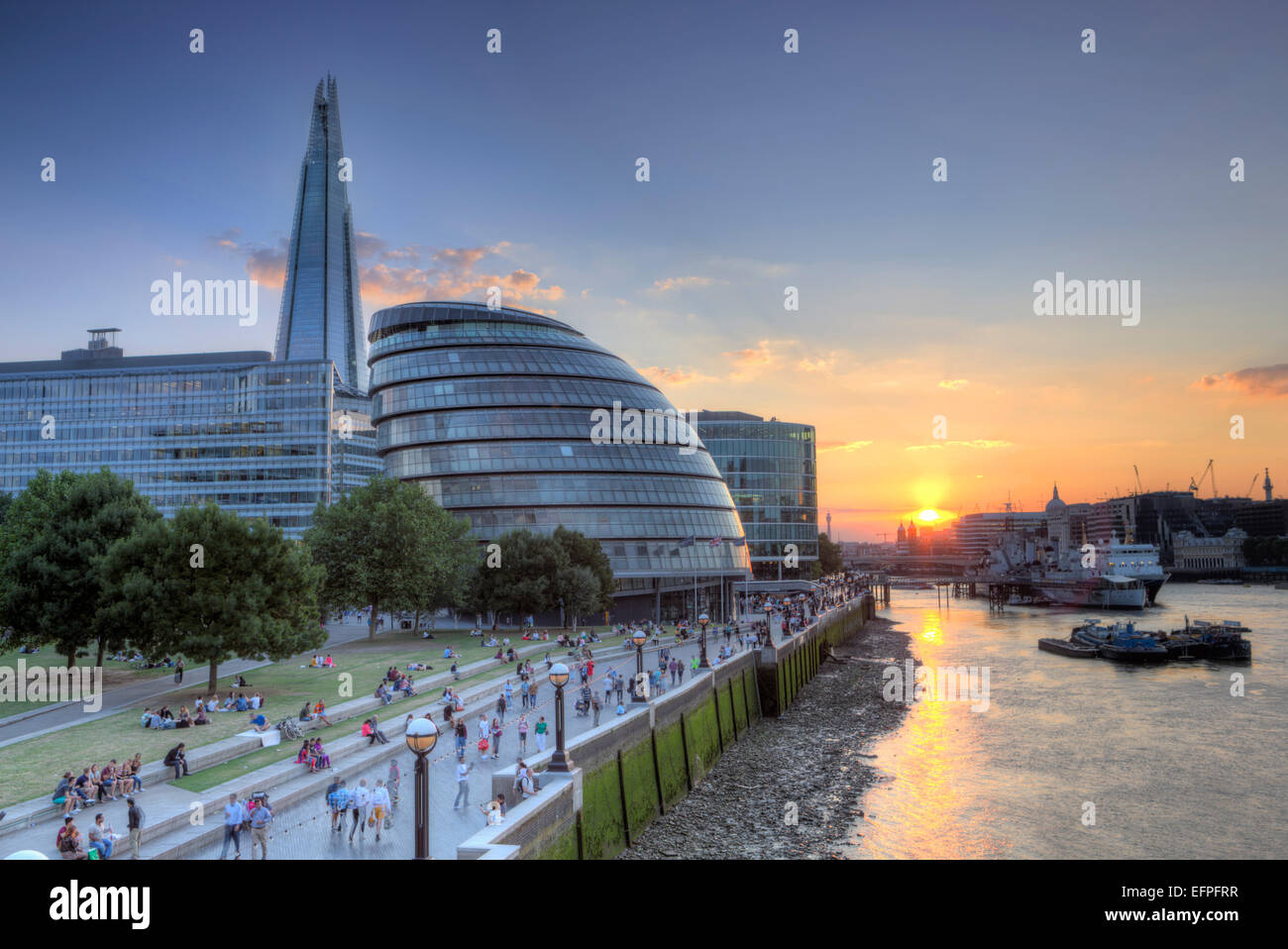 View of City Hall and the Shard on the south bank of the River Thames at sunset, London, England, United Kingdom, Europe Stock Photo